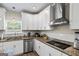 Modern kitchen showcases granite countertops, stainless appliances, and subway tile backsplash at 634 Gardner Rd, Stockbridge, GA 30281