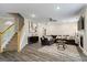 Bright living room with fireplace, stylish decor, and staircase access at 634 Gardner Rd, Stockbridge, GA 30281