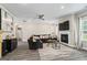 Cozy living room boasts a fireplace, comfortable seating, and stylish decor at 634 Gardner Rd, Stockbridge, GA 30281