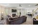 Spacious living room featuring a fireplace, plush sofa, and abundant natural light at 634 Gardner Rd, Stockbridge, GA 30281