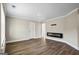 Bright living room with modern electric fireplace and wood-look flooring at 634 Gardner Rd, Stockbridge, GA 30281