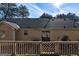 View of backyard with deck area perfect for outdoor entertaining and relaxing while enjoying nature at 113 Elmwood Dr, Hampton, GA 30228