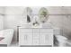 Bathroom features dual sinks, a soaking tub, and modern fixtures at 1450 Elizabeth Ln, East Point, GA 30344