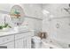 Elegant bathroom featuring a vessel sink, glass-enclosed shower with rainfall showerhead and marble walling at 1450 Elizabeth Ln, East Point, GA 30344