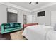 Bright bedroom with a plush rug, comfortable seating, and neutral decor at 1450 Elizabeth Ln, East Point, GA 30344