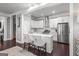 Modern kitchen with white cabinetry, stainless steel appliances, and a center island with seating at 1450 Elizabeth Ln, East Point, GA 30344