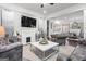 Elegant living room featuring neutral colors, fireplace, large TV, and lots of room for seating at 1450 Elizabeth Ln, East Point, GA 30344