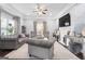 Stylish living room with comfortable seating, fireplace, TV, and a neutral color palette, and natural light at 1450 Elizabeth Ln, East Point, GA 30344