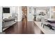 Open-concept living space with hardwood floors seamlessly connects to a modern kitchen, perfect for entertaining at 1450 Elizabeth Ln, East Point, GA 30344