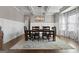 Dining area featuring coffered ceilings, a large window, and hardwood flooring at 240 Sturry Dr, Mcdonough, GA 30252