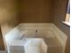 Large bathtub with tile and fixture at 416 Winterwood Dr, Stockbridge, GA 30281