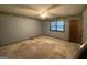 Bedroom with a ceiling fan, window, and wall trim at 416 Winterwood Dr, Stockbridge, GA 30281