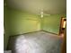 A green bedroom featuring ceiling fan and potential for customization at 416 Winterwood Dr, Stockbridge, GA 30281