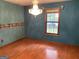Bedroom featuring hardwood floors, a chandelier and a window at 416 Winterwood Dr, Stockbridge, GA 30281