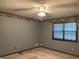 Large bedroom with a ceiling fan and a window, perfect for relaxation at 416 Winterwood Dr, Stockbridge, GA 30281