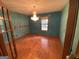 Bedroom featuring hardwood floors, a chandelier, and a window at 416 Winterwood Dr, Stockbridge, GA 30281