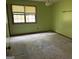 Bright bedroom with a ceiling fan and a large window, offering natural light at 416 Winterwood Dr, Stockbridge, GA 30281
