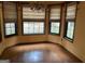 Dining area with hardwood floors, chandelier and three large windows at 416 Winterwood Dr, Stockbridge, GA 30281