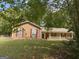 Charming single-story home featuring a covered front porch and a well-maintained lawn at 416 Winterwood Dr, Stockbridge, GA 30281