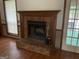 Close-up of a traditional brick fireplace with a decorative mantle at 416 Winterwood Dr, Stockbridge, GA 30281