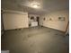 Large garage featuring a functional overhead door and ample space for storage or parking at 416 Winterwood Dr, Stockbridge, GA 30281