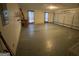Spacious garage featuring a functional overhead door and windows that flood the space with natural light at 416 Winterwood Dr, Stockbridge, GA 30281