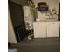 Convenient laundry room with modern washer, dryer, and water heater at 416 Winterwood Dr, Stockbridge, GA 30281