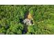 Overhead view showcases a house nestled amidst a dense forest, offering privacy at 2878 Heather Row Sw Rdg, Lilburn, GA 30047