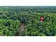 Expansive aerial view of property and mature forest with a nearby river offering both privacy and natural beauty at 2878 Heather Row Sw Rdg, Lilburn, GA 30047