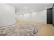Spacious finished basement features wood look floors and modern architectural details at 2878 Heather Row Sw Rdg, Lilburn, GA 30047