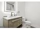 Bright bathroom featuring a modern sink, vanity and sleek, illuminated mirror at 2878 Heather Row Sw Rdg, Lilburn, GA 30047