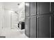 Modern bathroom with black cabinets, unique sink, and glass-enclosed shower stall at 2878 Heather Row Sw Rdg, Lilburn, GA 30047