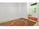 Bright bedroom featuring a large window and colorful storage bins, and patterned rug at 2878 Heather Row Sw Rdg, Lilburn, GA 30047