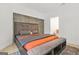 Bedroom with comfortable bed, unique headboard and view to a modern bathroom at 2878 Heather Row Sw Rdg, Lilburn, GA 30047