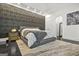 Comfortable bedroom with a large bed, textured wall, and stylish decor for a relaxing retreat at 2878 Heather Row Sw Rdg, Lilburn, GA 30047