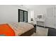 Bedroom with bed, makeup vanity, and a glimpse into the adjoining bathroom at 2878 Heather Row Sw Rdg, Lilburn, GA 30047