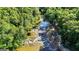Scenic view of a creek flowing through a lush, green, wooded landscape at 2878 Heather Row Sw Rdg, Lilburn, GA 30047