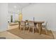 Bright dining room with minimalist furnishings and a view to the home's entry at 2878 Heather Row Sw Rdg, Lilburn, GA 30047