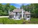 Rear exterior view showing the home's patio and surrounding yard at 2878 Heather Row Sw Rdg, Lilburn, GA 30047