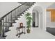 Foyer featuring a staircase with dark wood and a decorative tiled floor at 2878 Heather Row Sw Rdg, Lilburn, GA 30047
