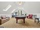 Spacious game room features a pool table, skylights, and comfortable seating area at 2878 Heather Row Sw Rdg, Lilburn, GA 30047