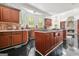 Gourmet kitchen featuring custom cabinets, a center island, and plenty of counter space at 2878 Heather Row Sw Rdg, Lilburn, GA 30047