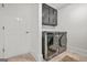 Laundry room with modern washer and dryer and built-in cabinets at 2878 Heather Row Sw Rdg, Lilburn, GA 30047