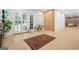 Open concept living room with decorative French doors, modern lighting and wood floors at 2878 Heather Row Sw Rdg, Lilburn, GA 30047