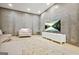 Living room with modern television set, sleek white console and a comfy armchair at 2878 Heather Row Sw Rdg, Lilburn, GA 30047