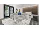 This primary bedroom includes a seating area and access to the bathroom at 2878 Heather Row Sw Rdg, Lilburn, GA 30047