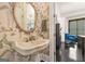 Charming powder room with floral wallpaper and a pedestal sink with views into the office at 2878 Heather Row Sw Rdg, Lilburn, GA 30047