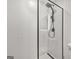 Modern glass enclosed shower stall with black showerhead in bathroom at 2878 Heather Row Sw Rdg, Lilburn, GA 30047