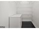 Walk-in closet is equipped with cabinets, drawers, and metal shelving for optimal storage at 2878 Heather Row Sw Rdg, Lilburn, GA 30047