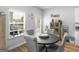 Bright dining area featuring a modern table, chairs, a window, and natural light at 445 Sawmill Trce, Hampton, GA 30228